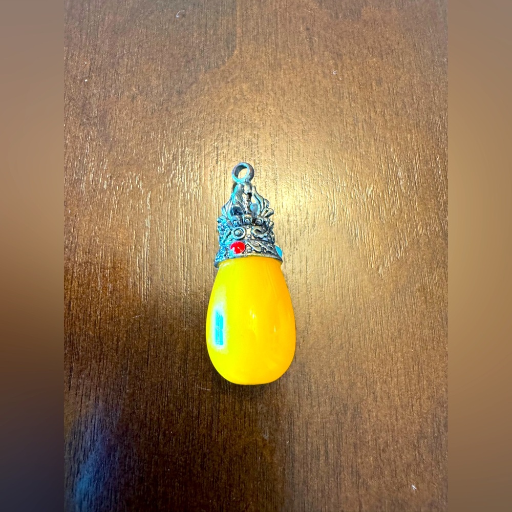 Amber Teardrop Pendant with Silver Accents